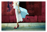 Profile of  a Headless Woman in Crimson Red Shoes, against a Crimson Red Metal Wall.