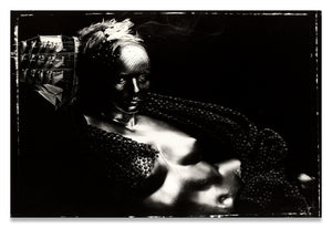 Horizontal Black and White Portrait, on Polaroid 55, of a nude, metallic mannequin torso with a Ship Hat and Feather Headpiece along the side of the Head-Fine Art Canvas Print