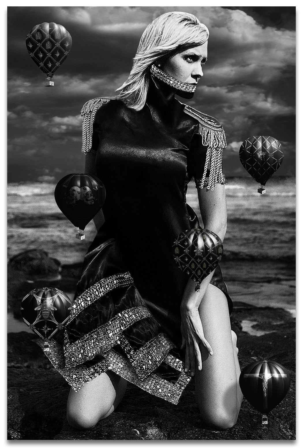 Black & White Portrait on a woman on her knees at the beach with a Neck Corset and small Black Hot Air Balloons- Fine Art Print
