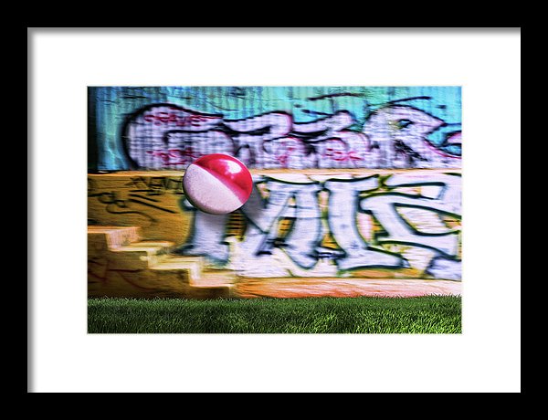 A Colorful Beach Ball in Mid Air Against a Graffiti Background at Griffith Park-Los Angeles. 
