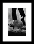 Black & White Portrait of a Woman's Legs Flying Through Stormy Skies- Framed Fine Art Print